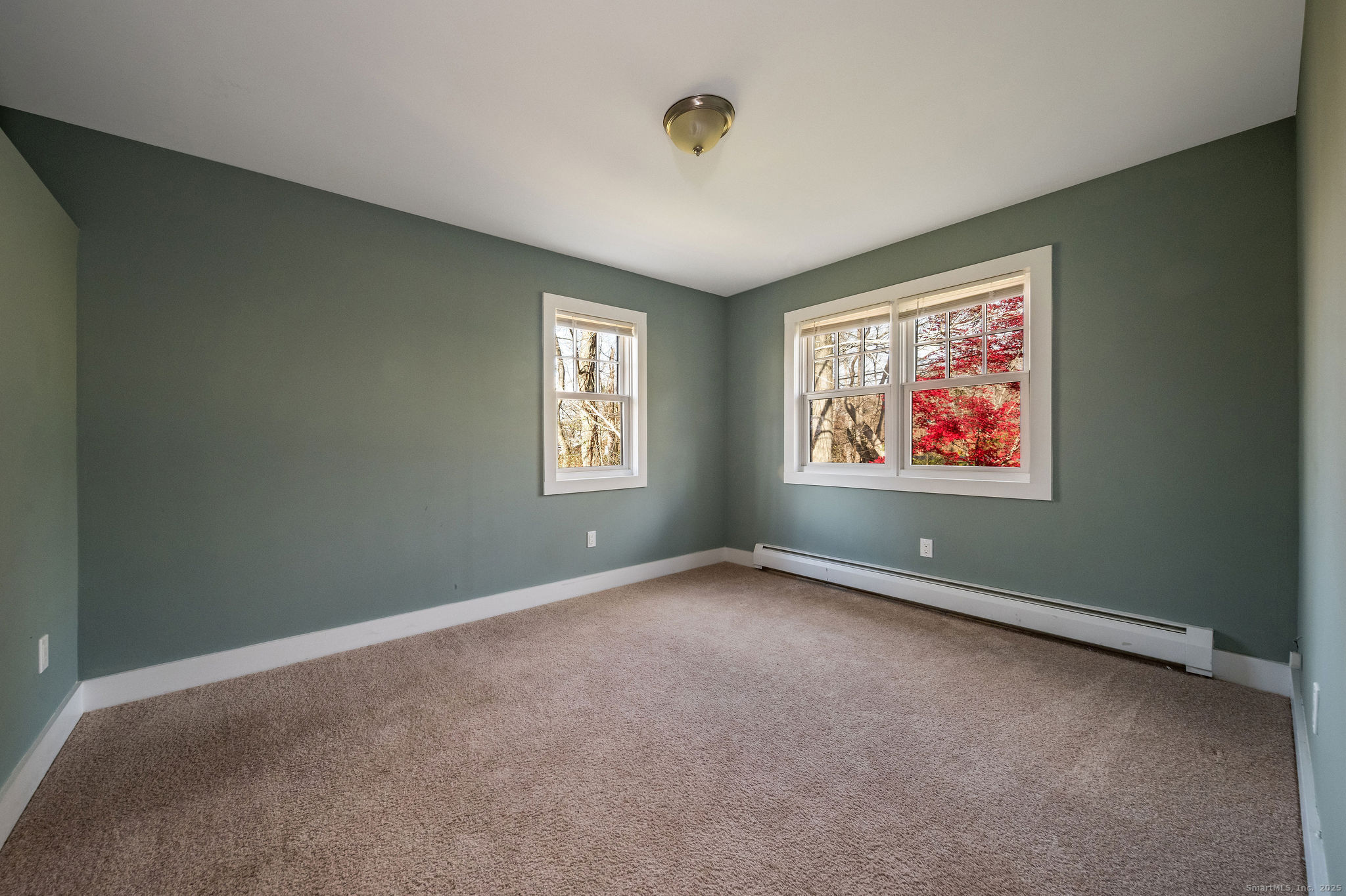 90 Boston Post Road Madison, CT 06443 - Photo 21 of 38 a view of an empty room with a window