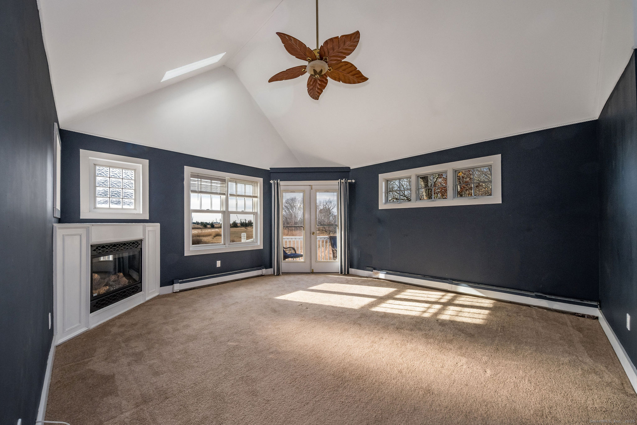 90 Boston Post Road Madison, CT 06443 - Photo 24 of 38 a view of livingroom and window with fireplace
