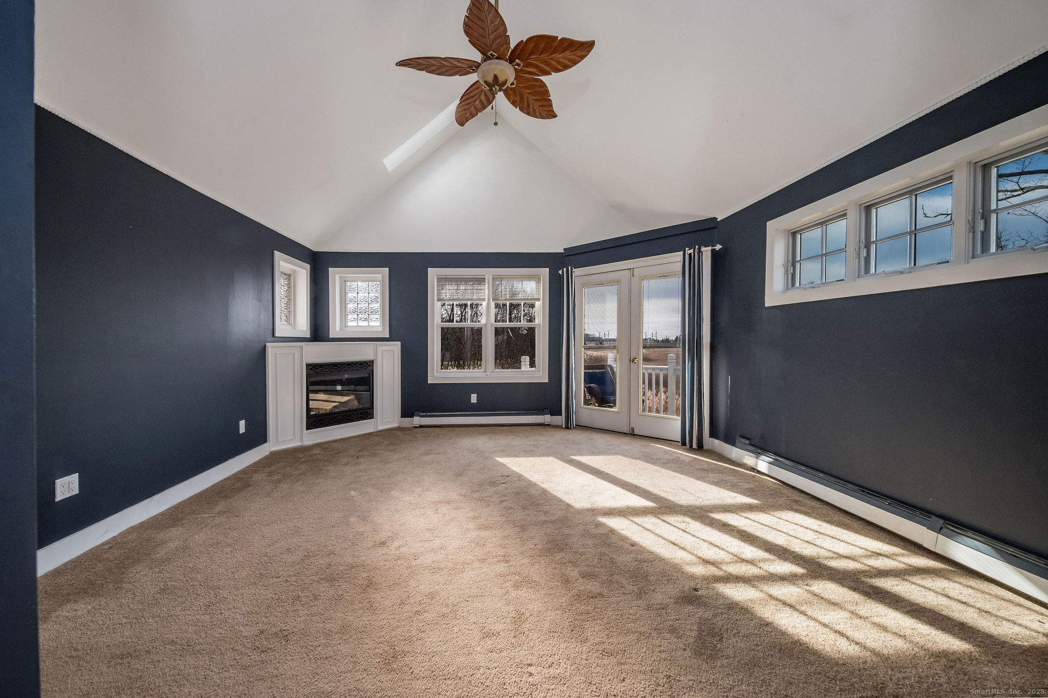 90 Boston Post Road Madison, CT 06443 - Photo 25 of 38 a view of an empty room with a window and fireplace
