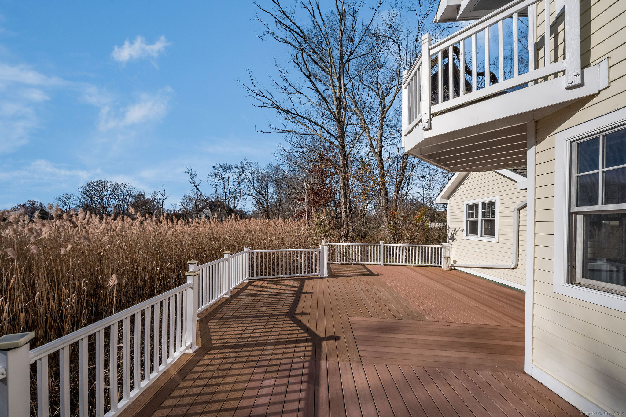 90 Boston Post Road Madison, CT 06443 - Photo 32 of 38 a view of house with backyard and trees