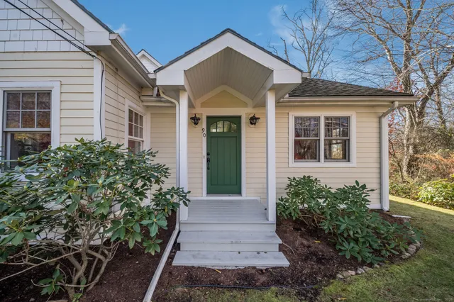 front view of a house with a yard
