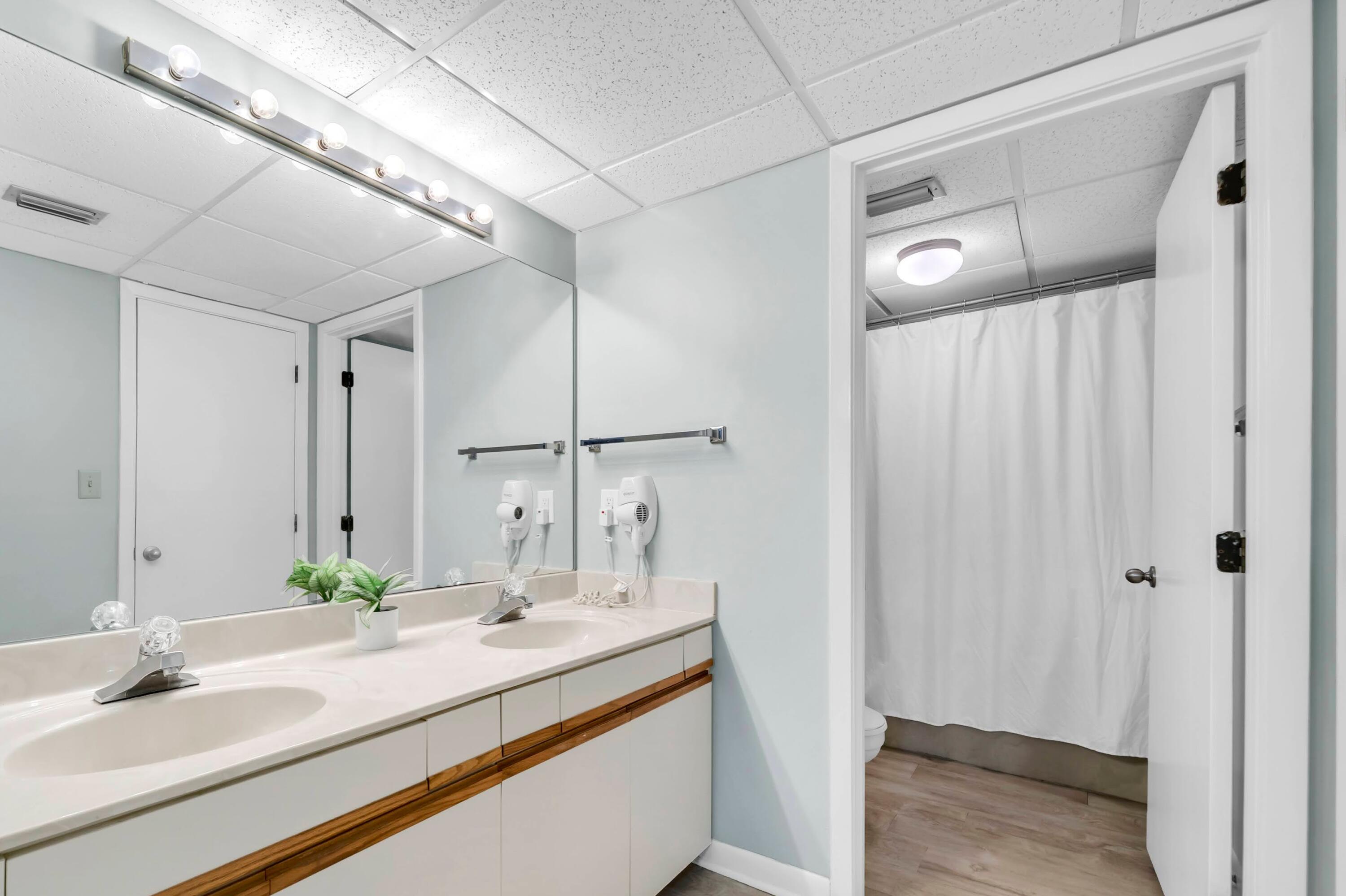 11619 Front Beach Road, Unit 307 Panama City Beach, FL 32407 - Photo 19 of 48 a bathroom with a sink and a mirror