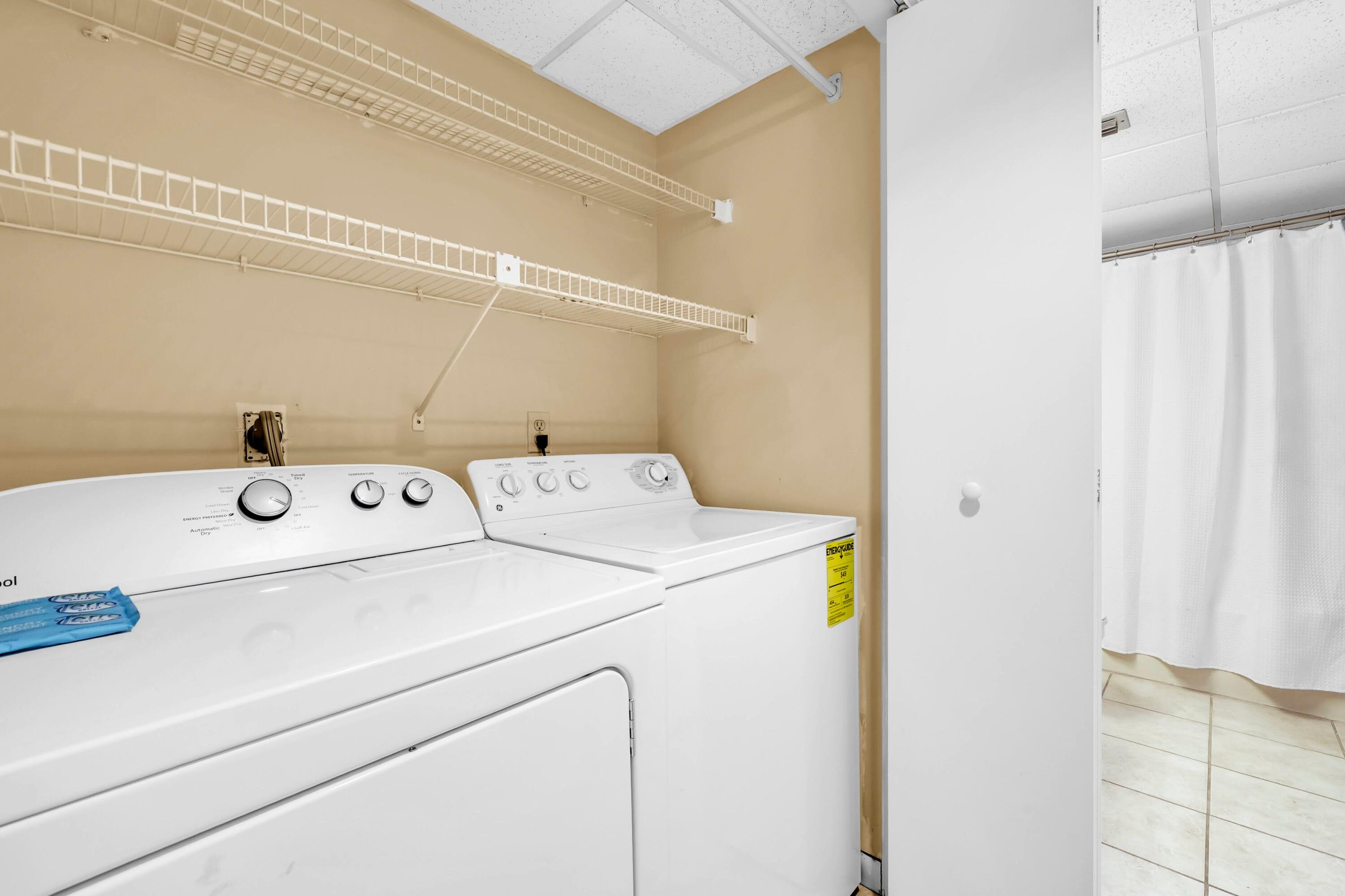 11619 Front Beach Road, Unit 307 Panama City Beach, FL 32407 - Photo 22 of 48 a utility room with dryer and washer