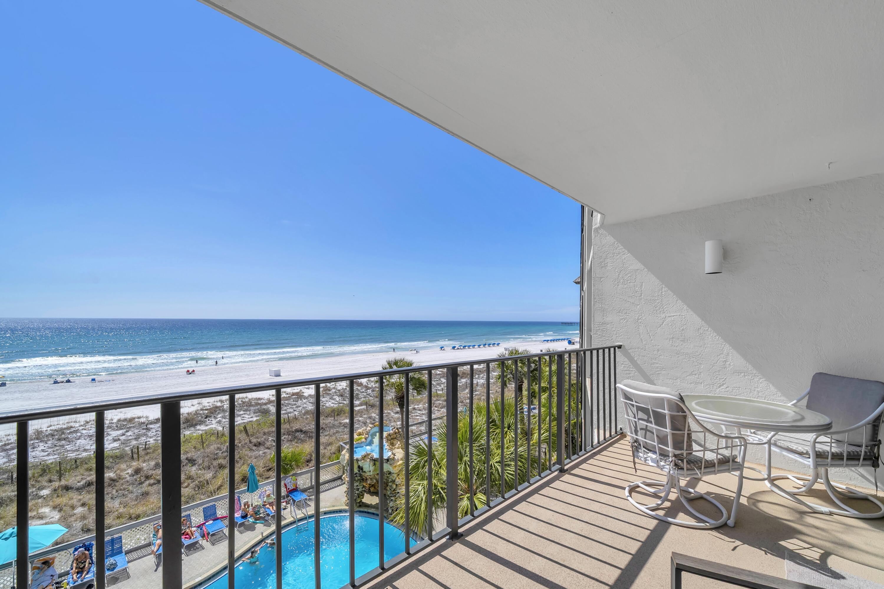 11619 Front Beach Road, Unit 307 Panama City Beach, FL 32407 - Photo 24 of 48 a view of wooden balcony with furniture
