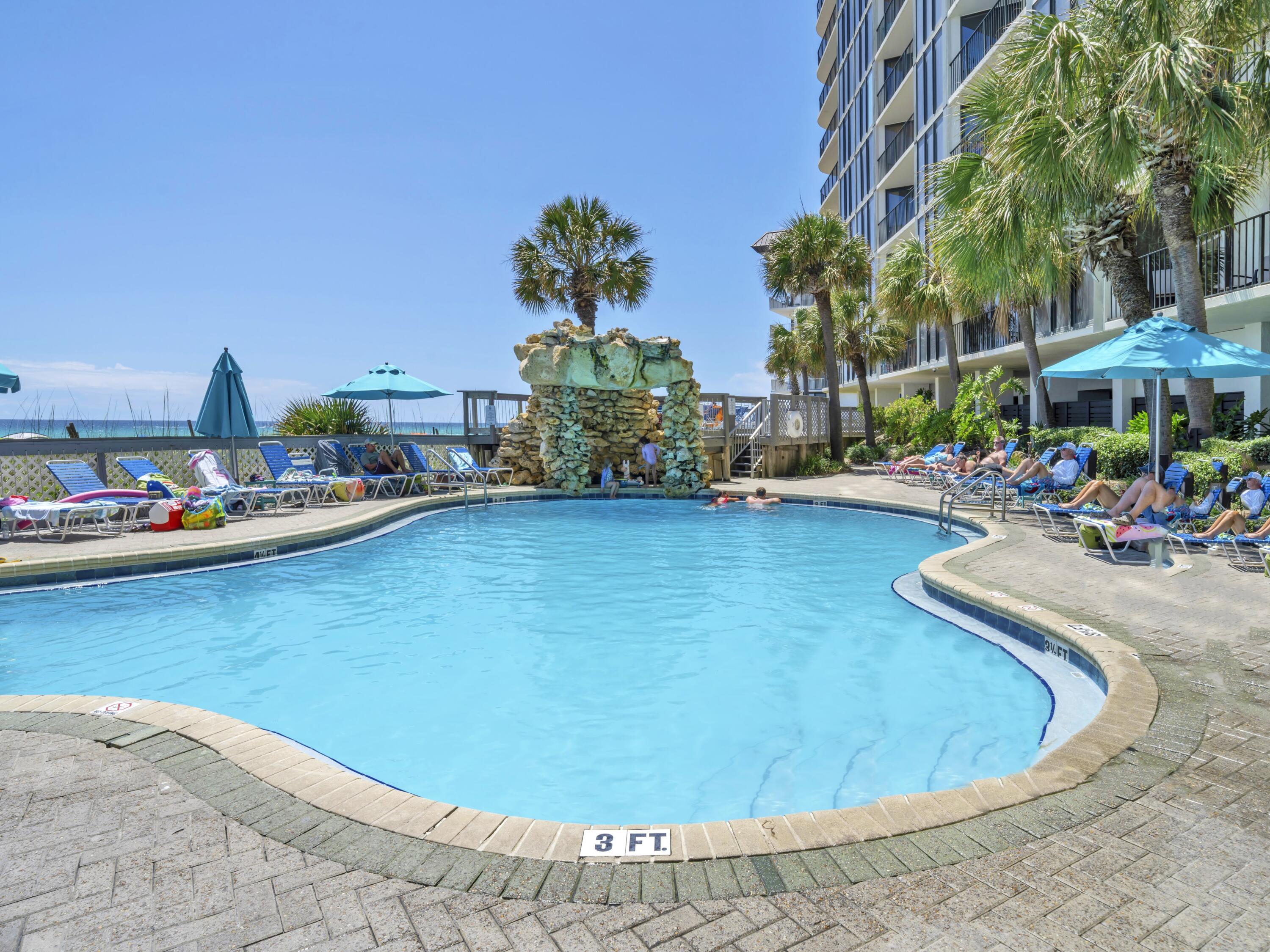 11619 Front Beach Road, Unit 307 Panama City Beach, FL 32407 - Photo 25 of 48 a view of a swimming pool with outdoor seating