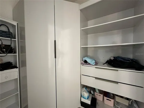 a bathroom with a double vanity sink mirror and toilet