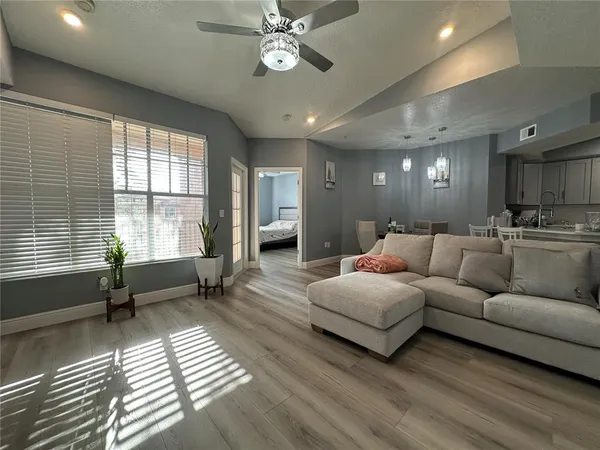 a living room with furniture and a large window