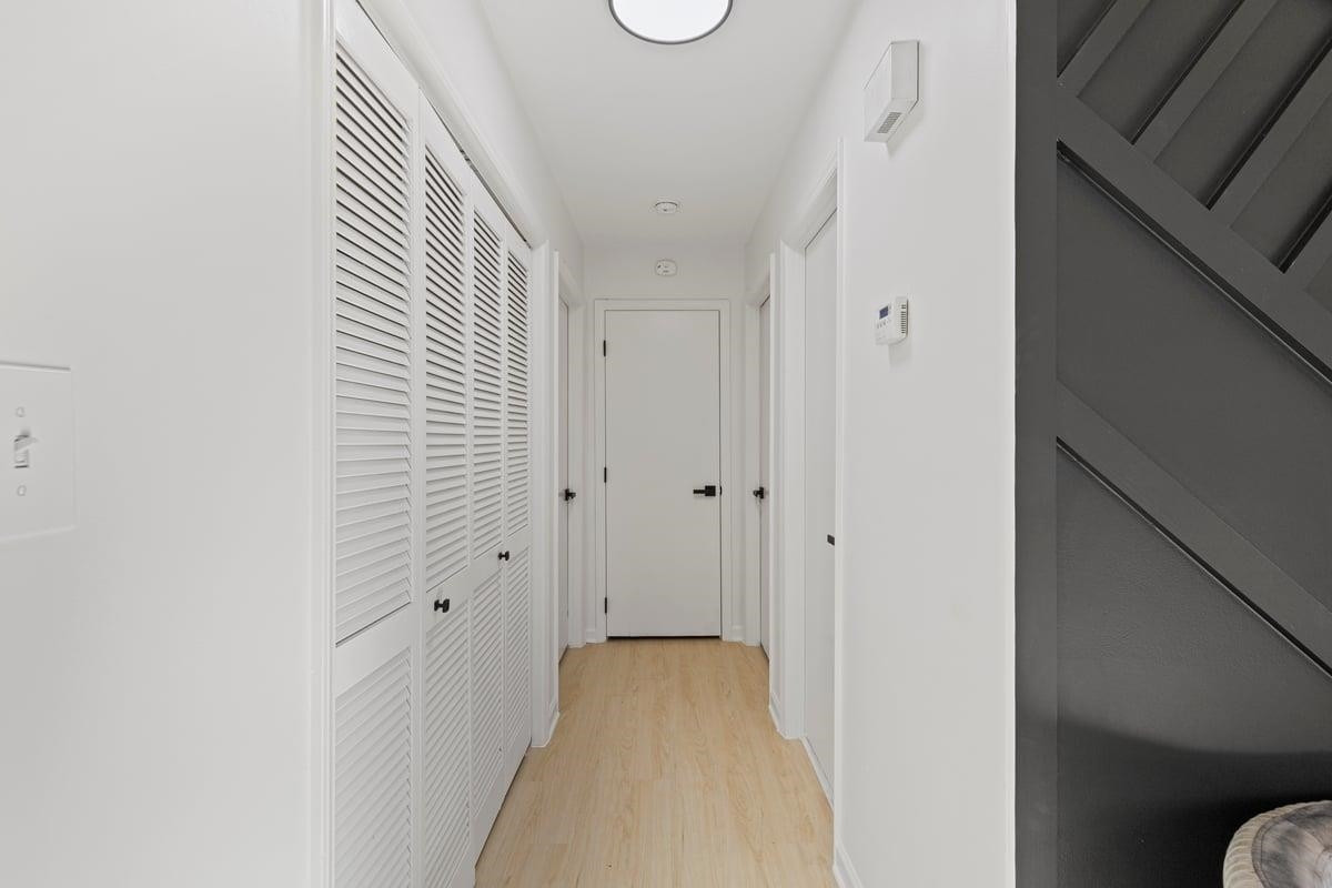 2718 Omah Street Durham, NC 27705 - Photo 12 of 20 a view of a hallway with wooden floor