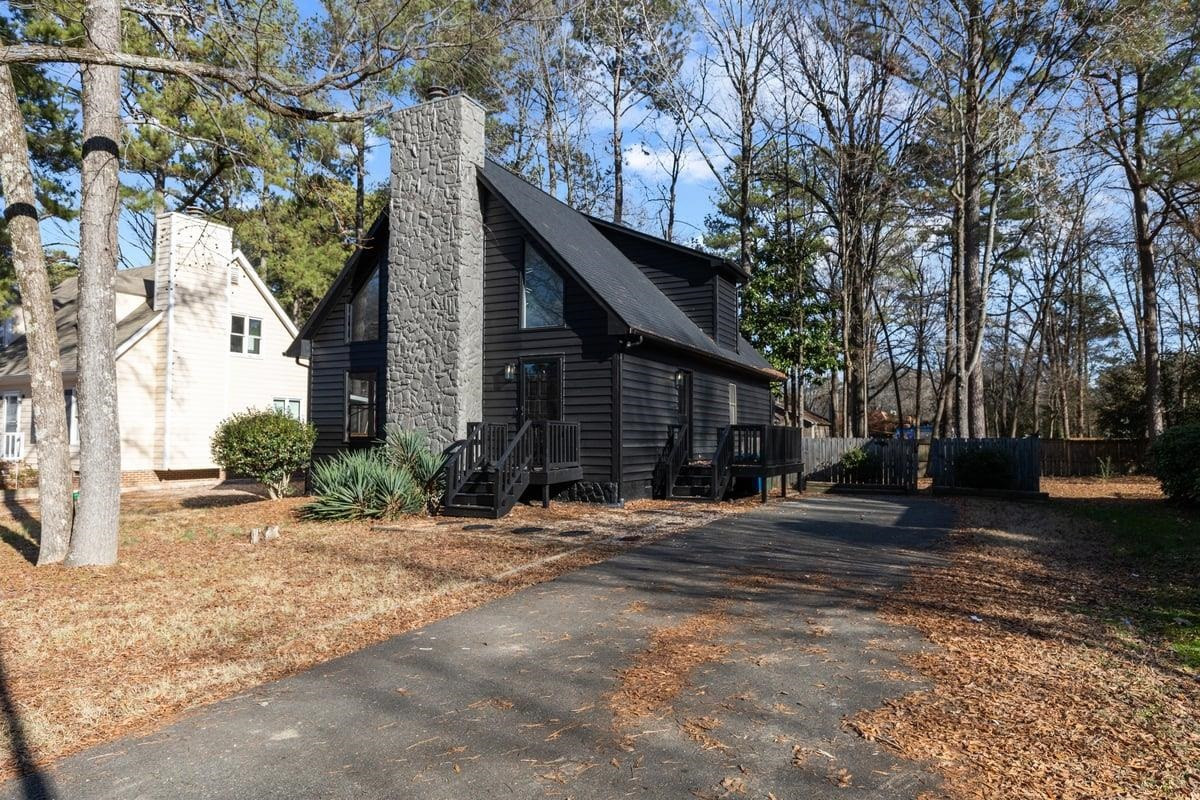 2718 Omah Street Durham, NC 27705 - Photo 2 of 20 a pathway of a house with a yard