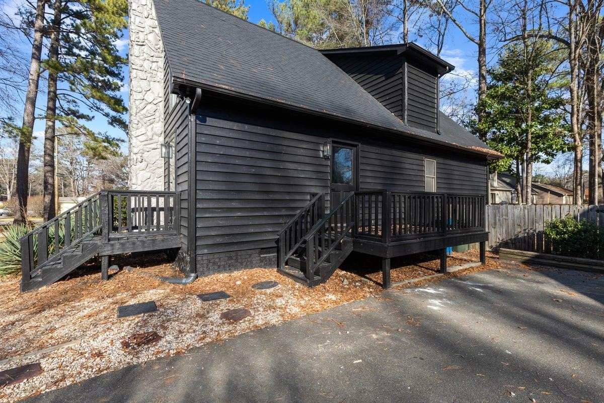 2718 Omah Street Durham, NC 27705 - Photo 4 of 20 a view of a house with a yard and wooden fence