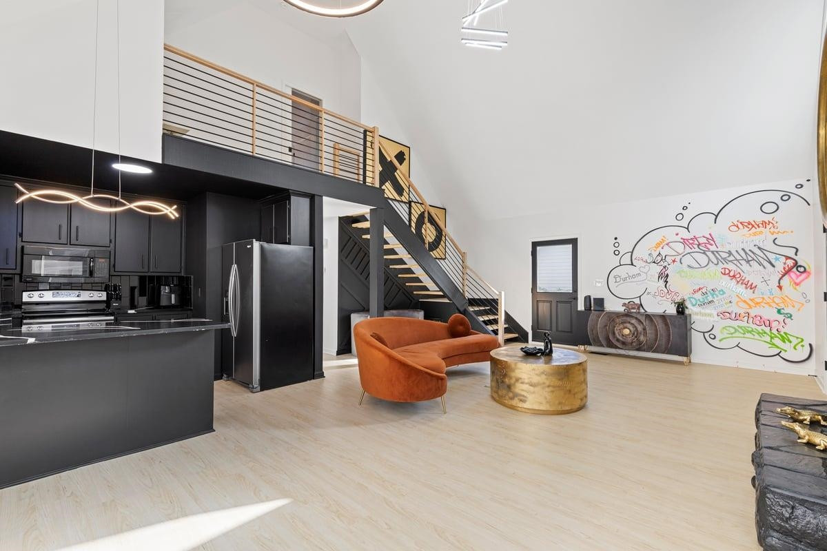 2718 Omah Street Durham, NC 27705 - Photo 8 of 20 a kitchen with stainless steel appliances granite countertop a sink and dishwasher