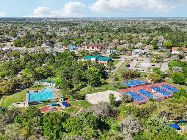 an aerial view of residential house with outdoor space and swimming pool
