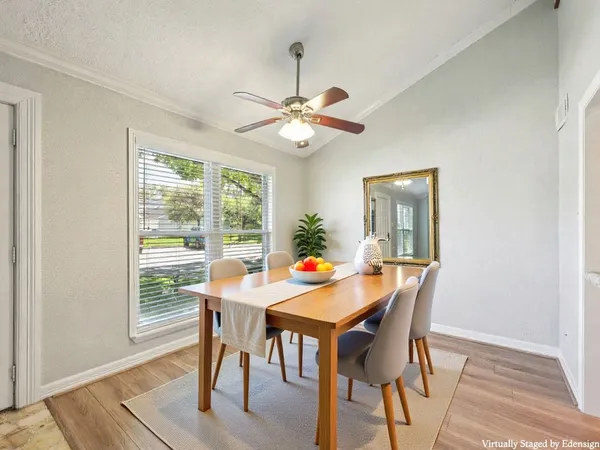 a view of a dining room with furniture window and wooden floor