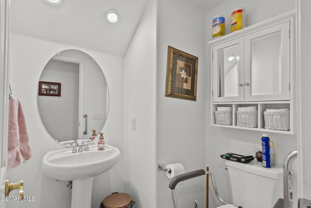 2046 Freesia Avenue Simi Valley, CA 93063 - Photo 11 of 37 a bathroom with a sink mirror and toilet