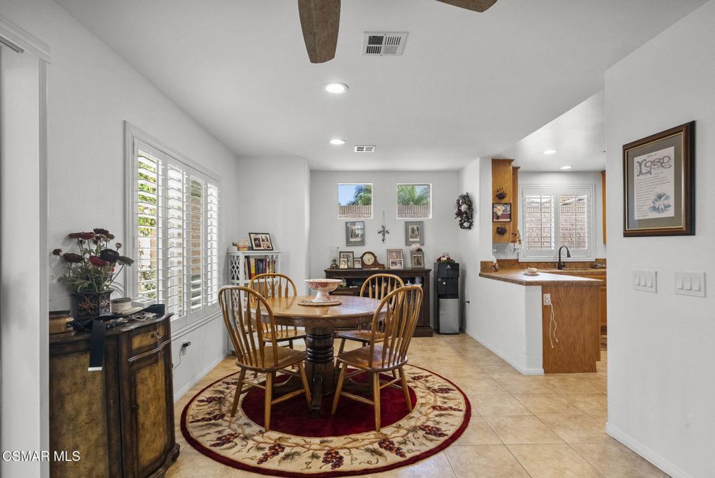 2046 Freesia Avenue Simi Valley, CA 93063 - Photo 13 of 37 a view of a dining room with furniture window and wooden floor