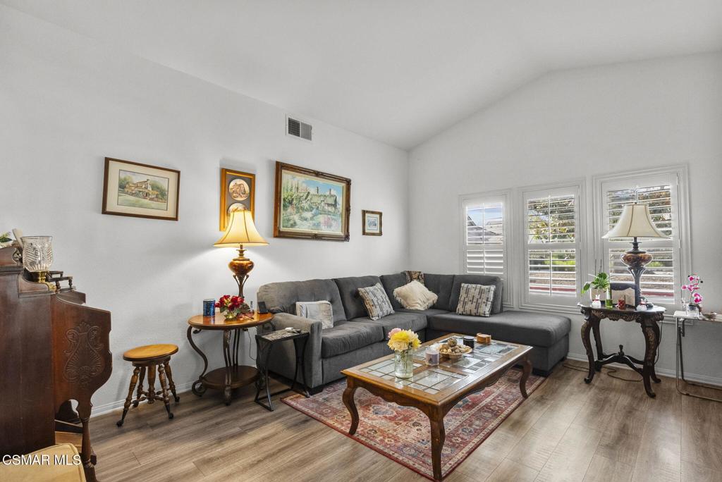 2046 Freesia Avenue Simi Valley, CA 93063 - Photo 21 of 37 a living room with furniture and a wooden floor