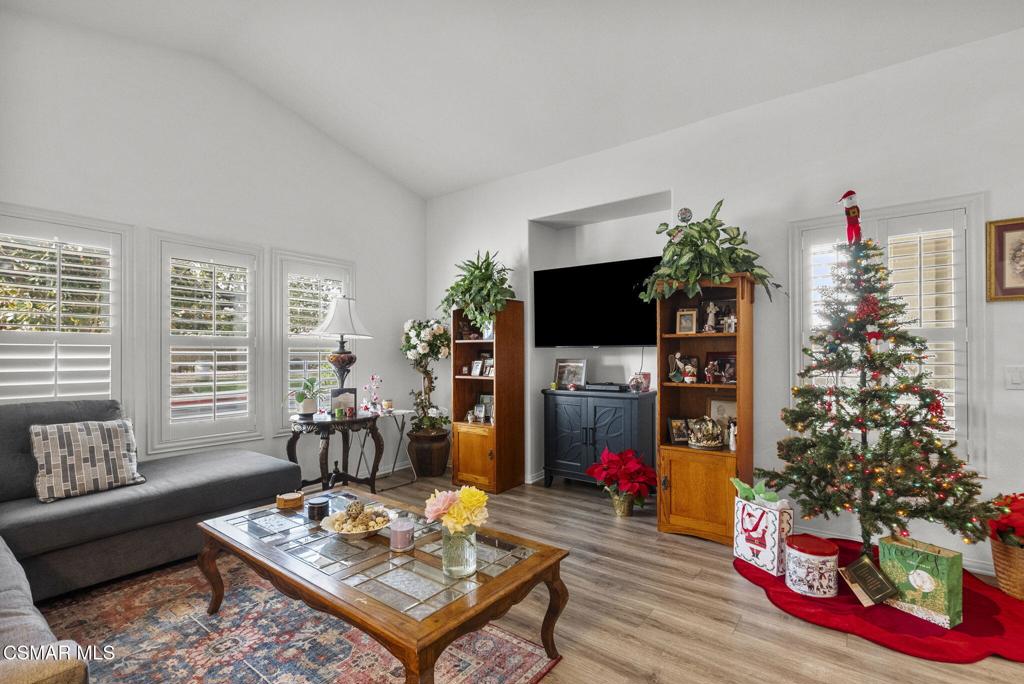 2046 Freesia Avenue Simi Valley, CA 93063 - Photo 22 of 37 a living room with furniture a flat screen tv and a christmas tree