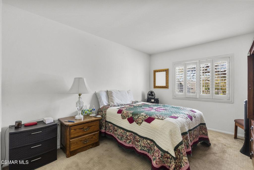 2046 Freesia Avenue Simi Valley, CA 93063 - Photo 28 of 37 a bedroom with a bed and a window