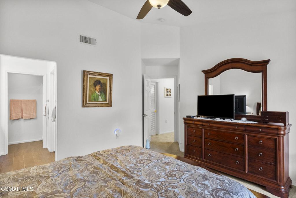 2046 Freesia Avenue Simi Valley, CA 93063 - Photo 8 of 37 a bedroom with a bed and a television