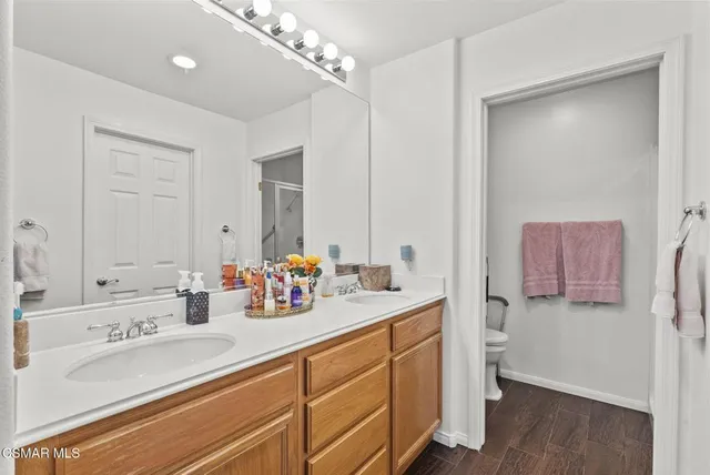 a bathroom with a sink a vanity and a mirror