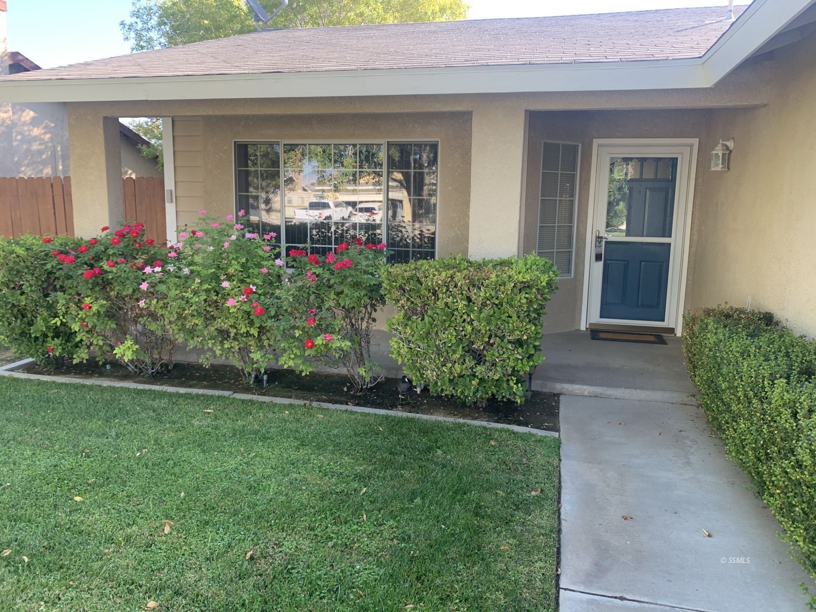 328 Ashton Street Ridgecrest, CA 93555 - Photo 2 of 28 front view of a house with a yard