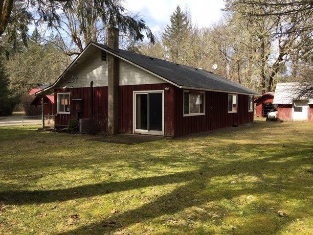 7900 Takilma Road Cave Junction, OR 97523 - Photo 3 of 22 Back yard small patio off living room
