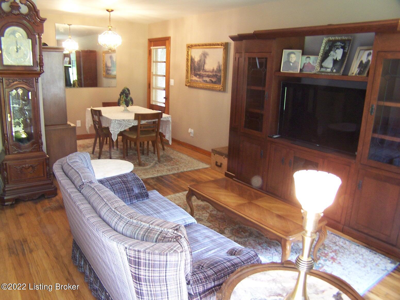 1627 Whippoorwill Road Louisville, KY 40213 - Photo 12 of 29 Living Room with hardwood flooring, large picture window for natural lighting, access to the Dining Room and the Eat-In Kitchen.