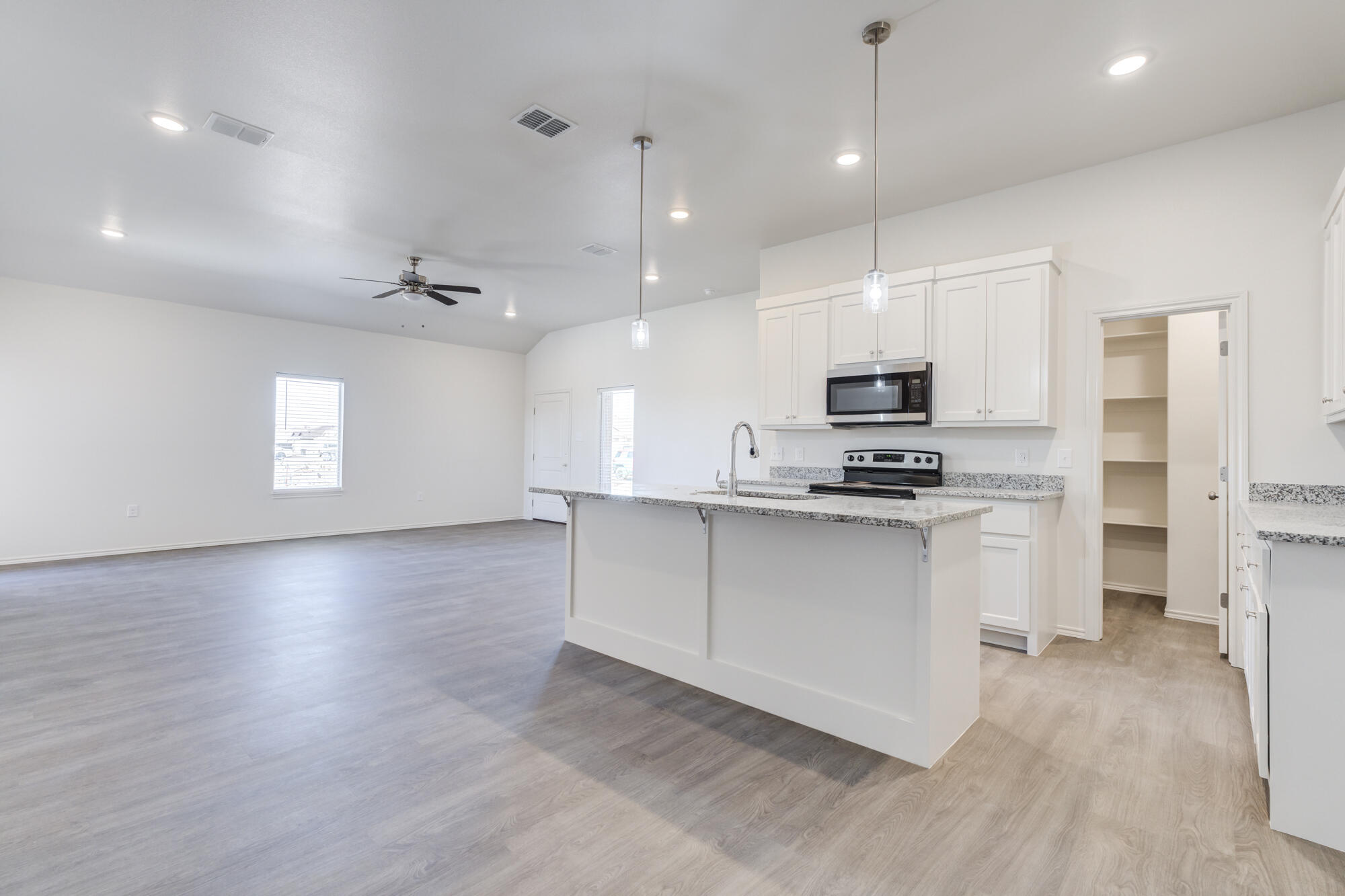 7011 40th Street Lubbock, TX 79407 - Photo 14 of 32 a view of kitchen with sink and microwave