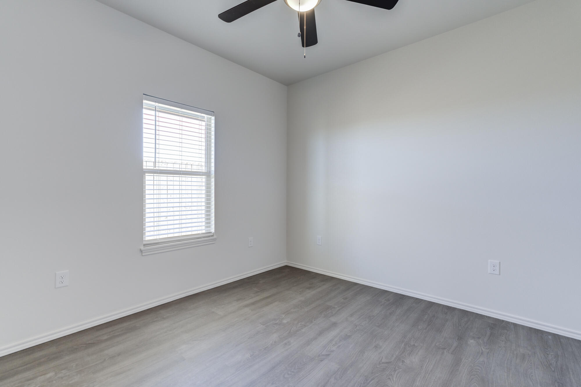7011 40th Street Lubbock, TX 79407 - Photo 19 of 32 an empty room with a window