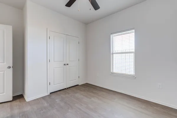 a bathroom with a granite countertop sink a toilet and bathtub