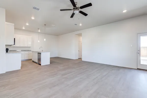 a view of kitchen with stainless steel appliances refrigerator microwave and stove