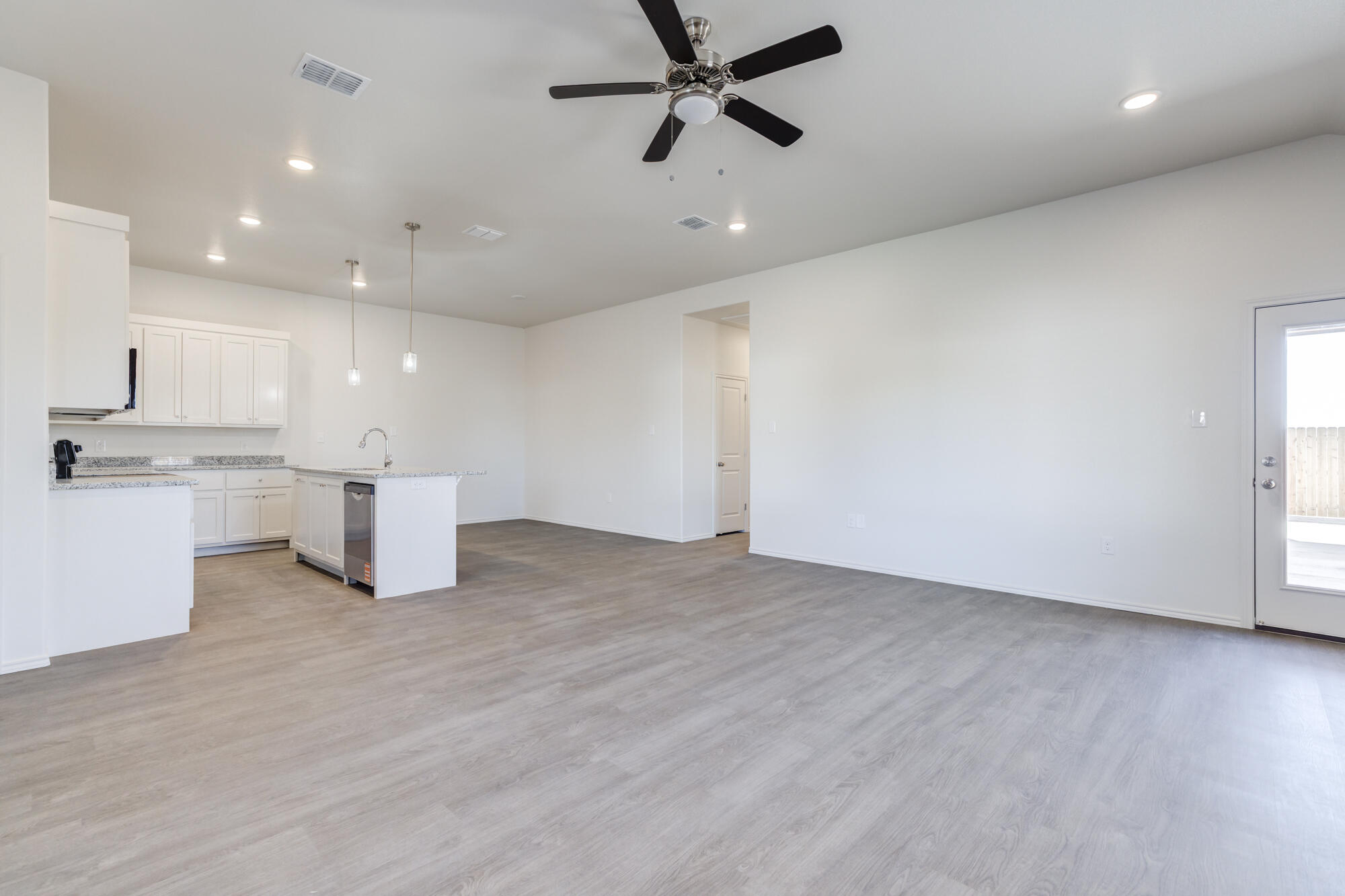 7011 40th Street Lubbock, TX 79407 - Photo 2 of 32 a view of kitchen with stainless steel appliances refrigerator microwave and stove