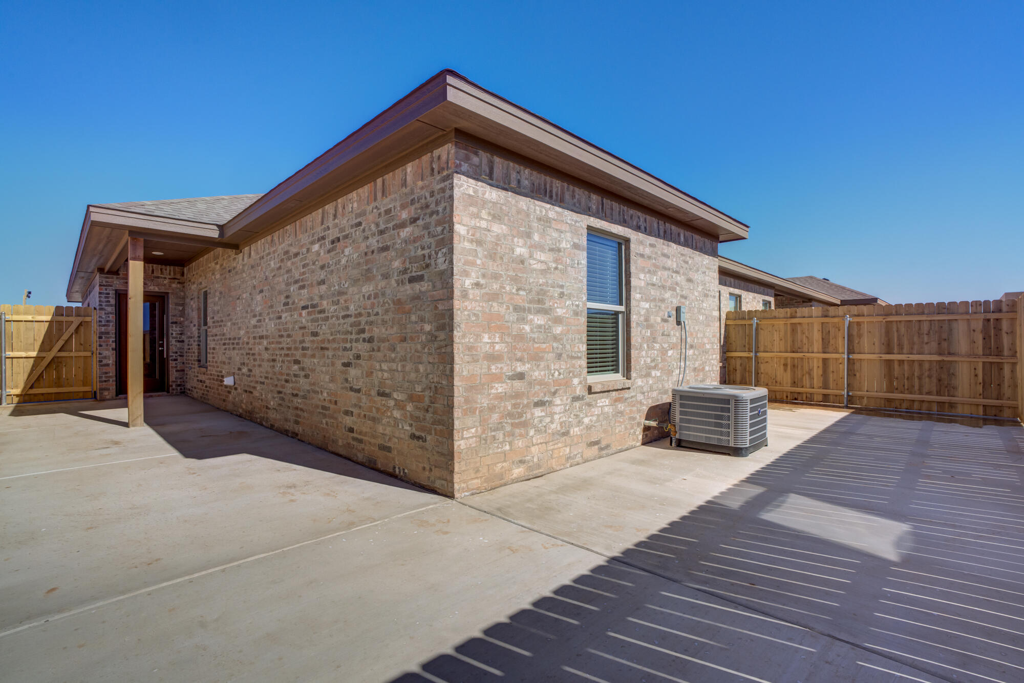 7011 40th Street Lubbock, TX 79407 - Photo 32 of 32 a front view of a house with garden