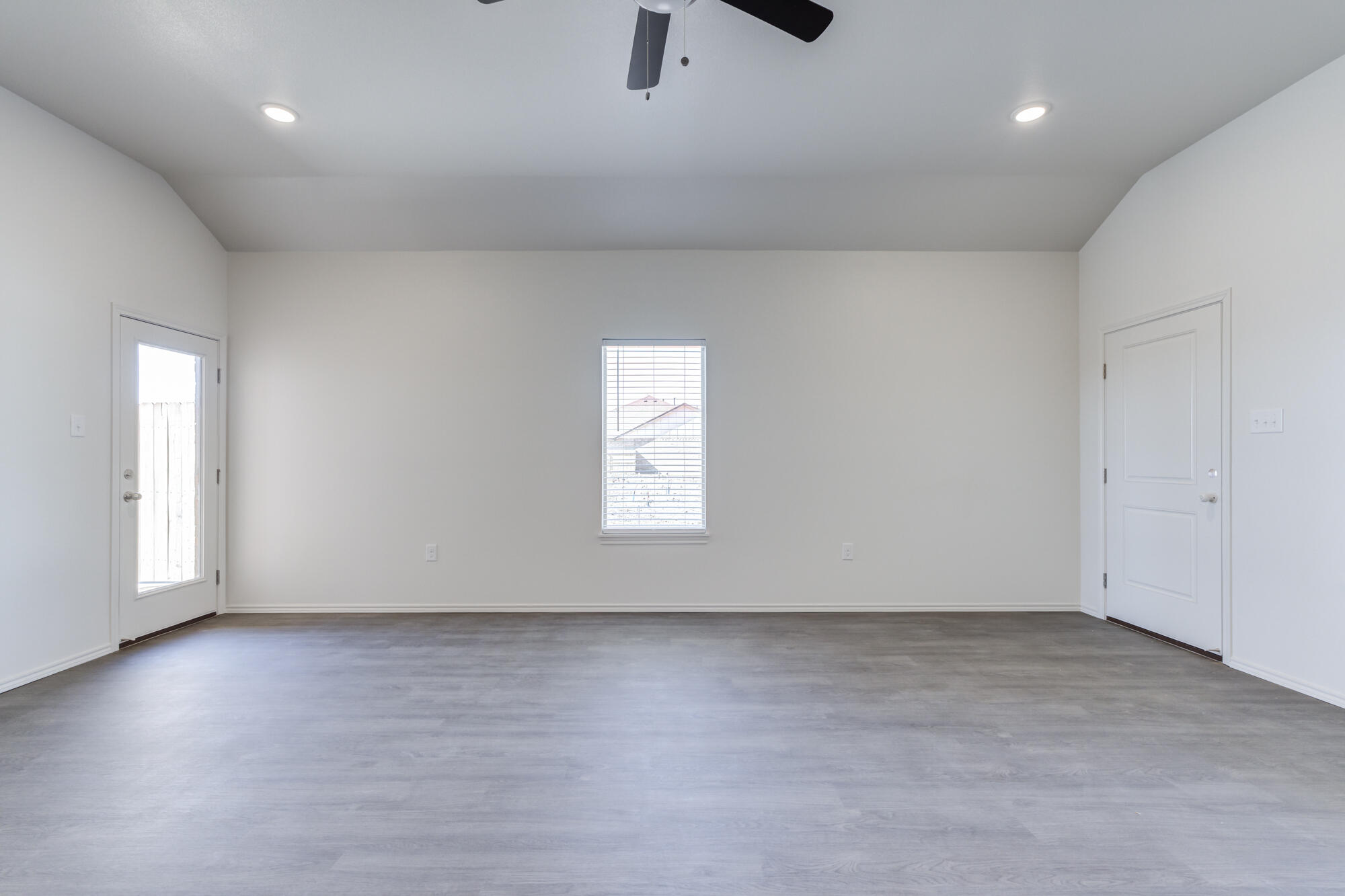 7011 40th Street Lubbock, TX 79407 - Photo 5 of 32 an empty room with a window