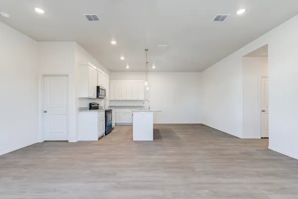 a view of kitchen with wooden floor