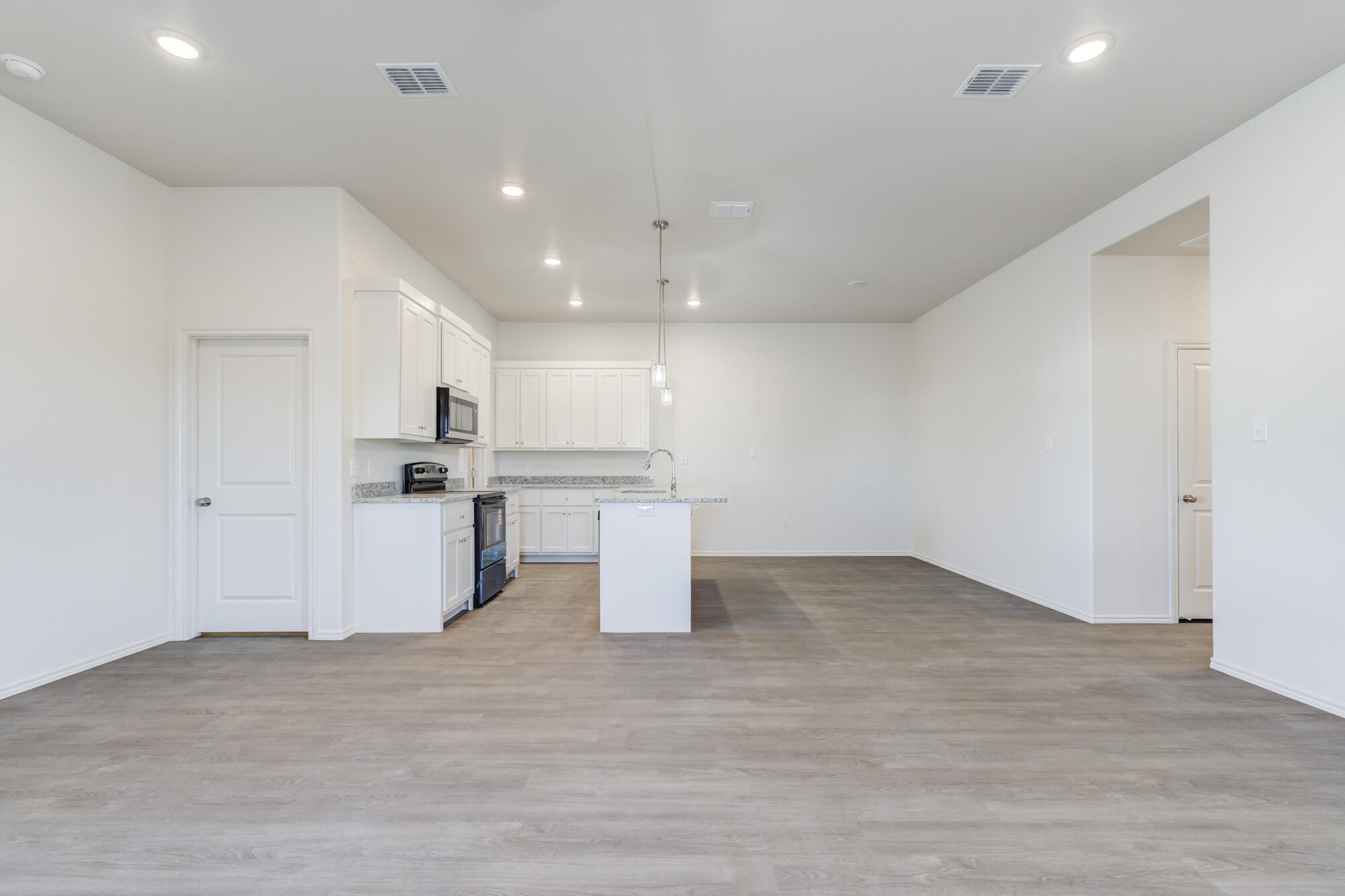 7011 40th Street Lubbock, TX 79407 - Photo 8 of 32 a view of kitchen with wooden floor