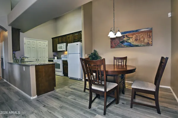 a kitchen with stainless steel appliances granite countertop a sink and a counter top space