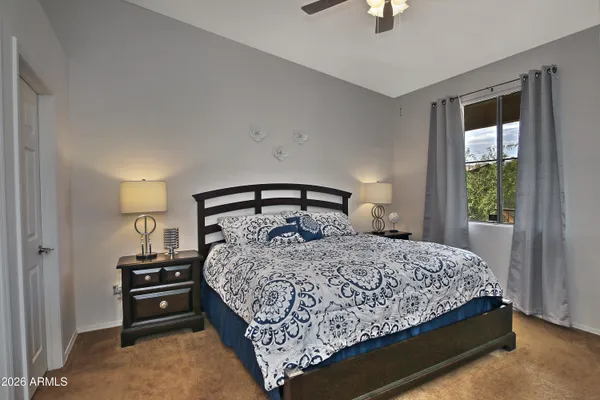 a kitchen with granite countertop a refrigerator stove and sink