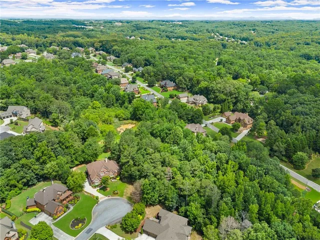 a view of a garden with a building in the background
