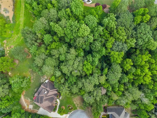 a backyard of a house with outdoor seating and green space
