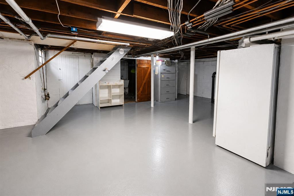 298 Audubon Road Englewood, NJ 07631 - Photo 17 of 19 a view of an empty room with stairs