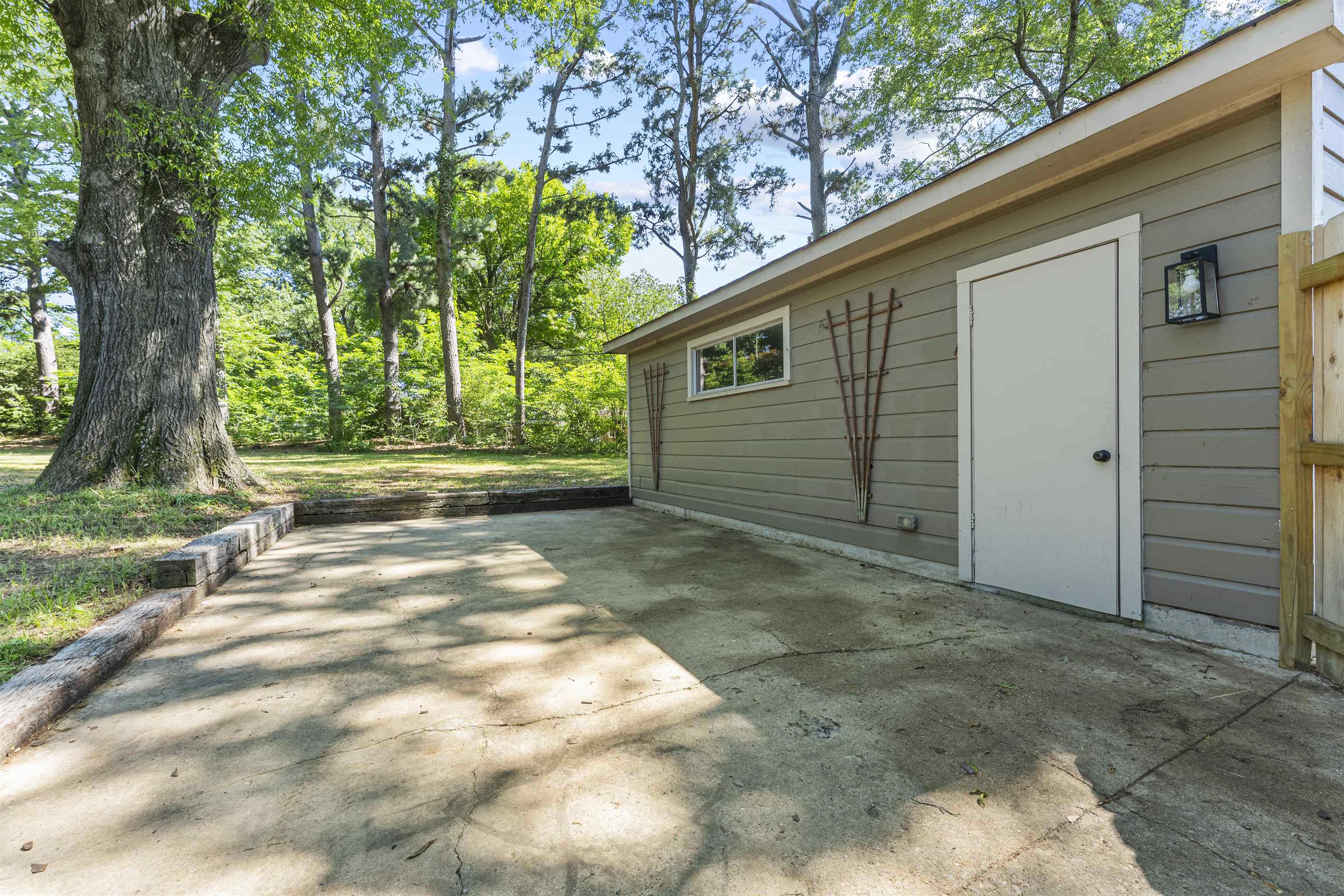 5271 Princeton Road Memphis, TN 38120 - Photo 30 of 30 Exterior accessory structure with horizontal siding, a single window, and an exterior door