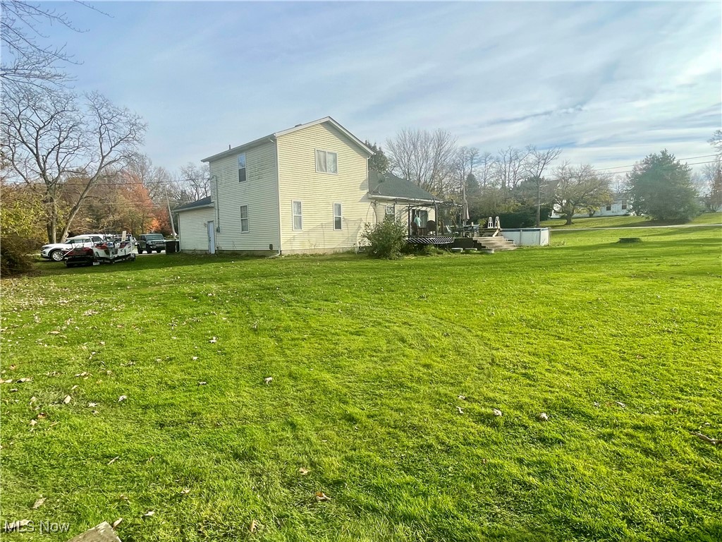 7990 Quarry Road Amherst, OH 44001 - Photo 26 of 29 View of side of property with a yard