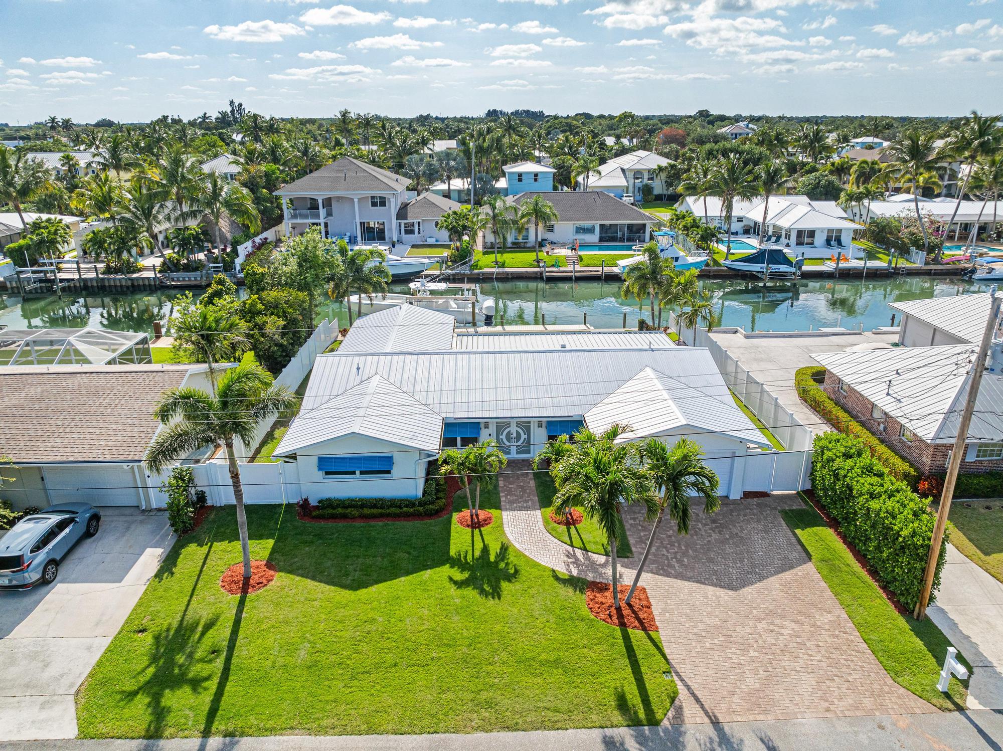 932 Marlin Circle Jupiter, FL 33458 - Photo 2 of 56 an aerial view of a house with garden space and street view