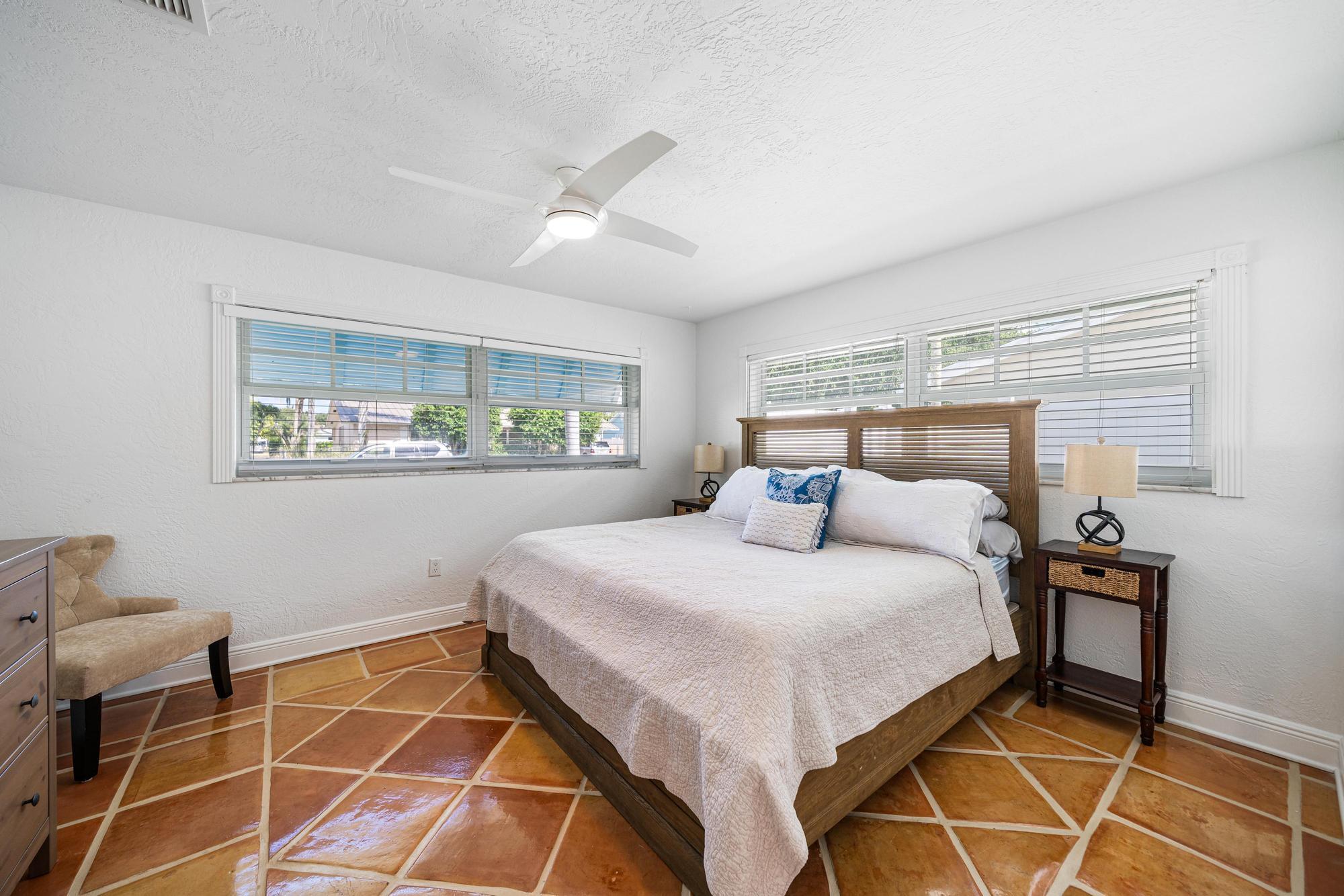 932 Marlin Circle Jupiter, FL 33458 - Photo 28 of 56 a bedroom with a bed and a window in it