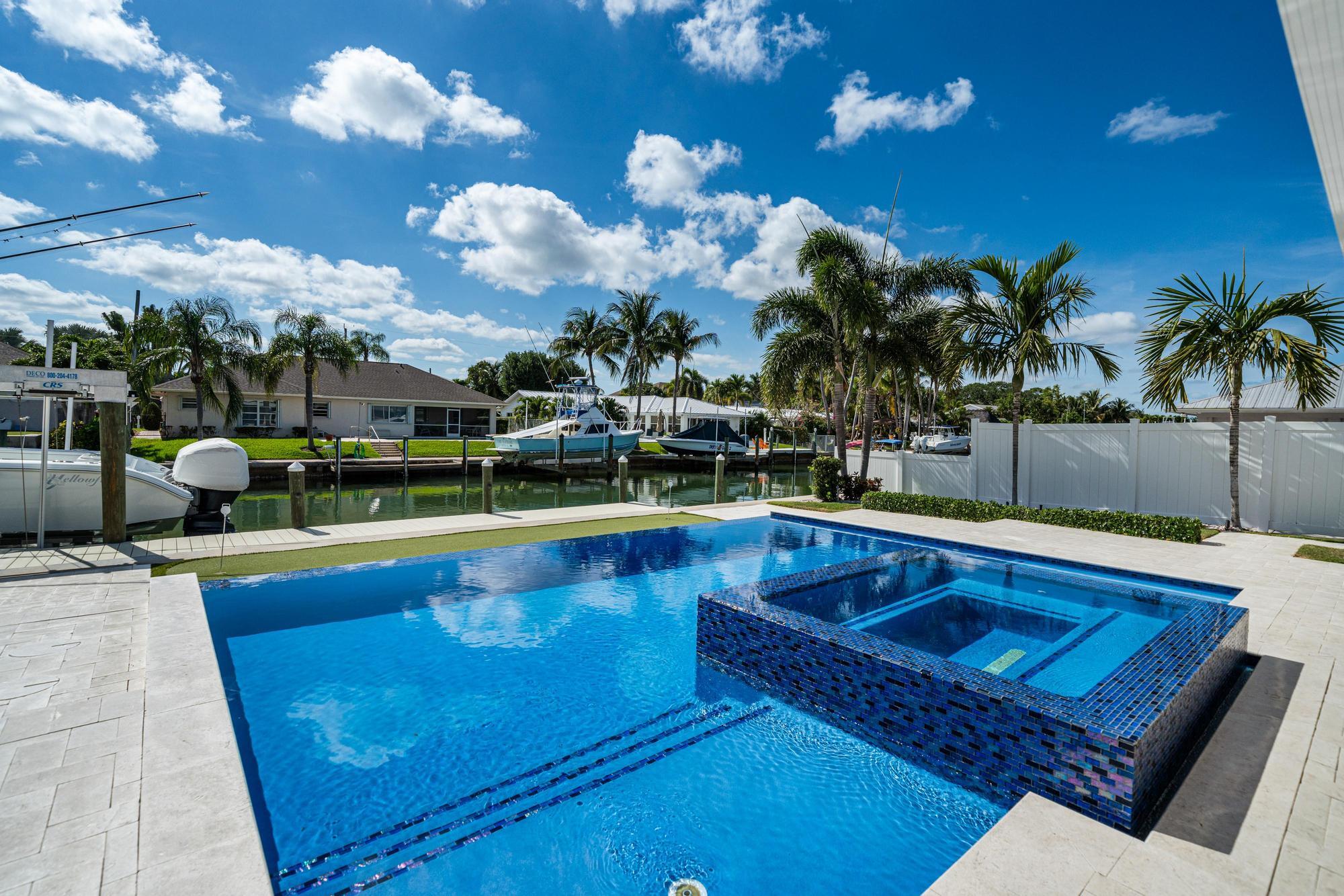 932 Marlin Circle Jupiter, FL 33458 - Photo 43 of 56 a view of a swimming pool with a patio
