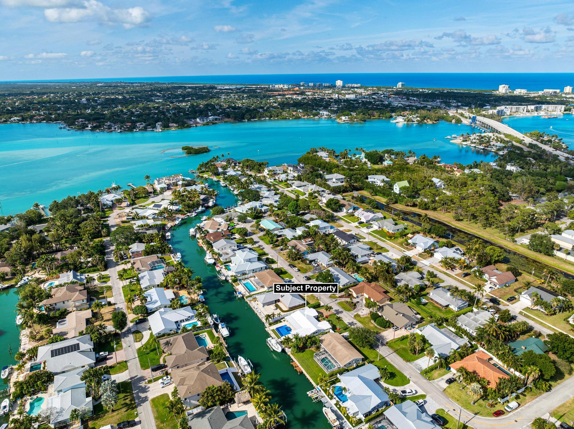 932 Marlin Circle Jupiter, FL 33458 - Photo 52 of 56 an aerial view of a residential houses with outdoor space and trees all around