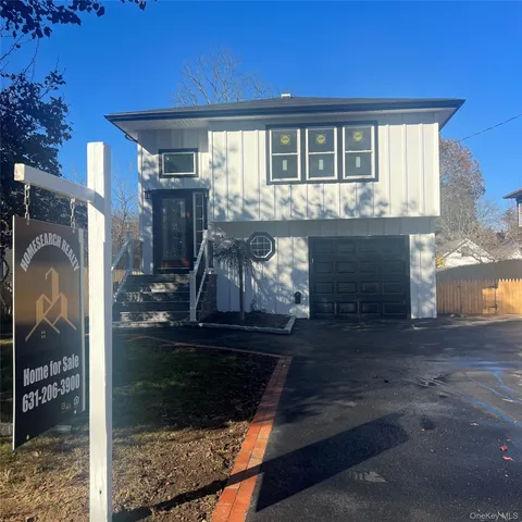 a front view of a house with yard