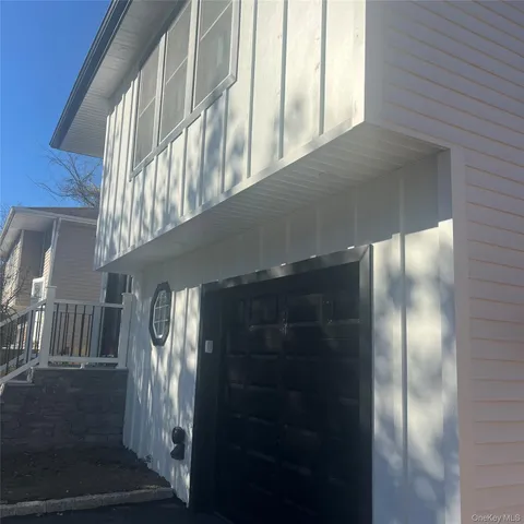 a view of staircase with large windows