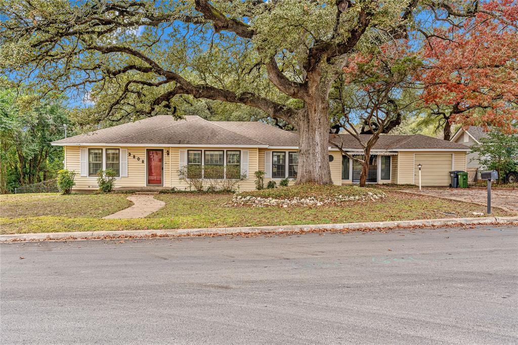 3808 North 27th Street Waco, TX 76708 - Photo 12 of 39 a front view of a house with a yard